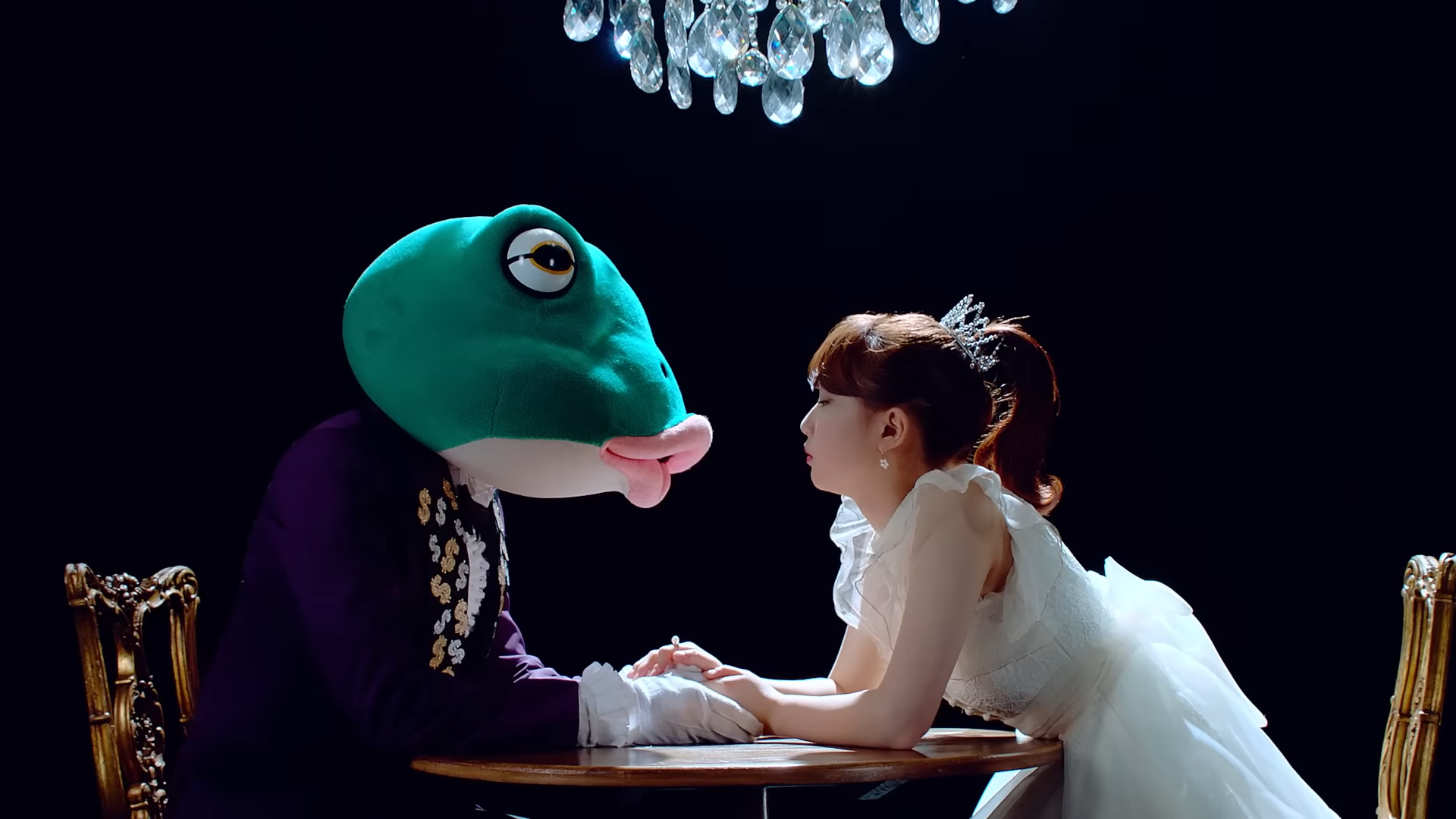 Yeojin leaning in to kiss the frog.